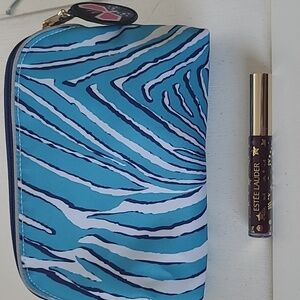 Estee Lauder lip gloss divine plum with make up bag